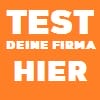 Ein orangefarbenes Bild mit dem Text 'TEST DEINE FIRMA HIER' in weißen Buchstaben.